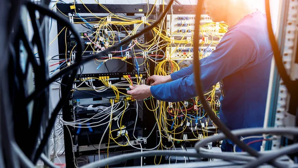 depositphotos 381344202 stock photo network engineer working in server